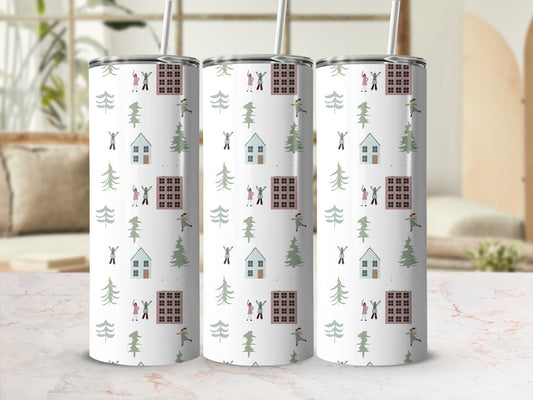 Three tumblers with a Christmas village and trees pattern.