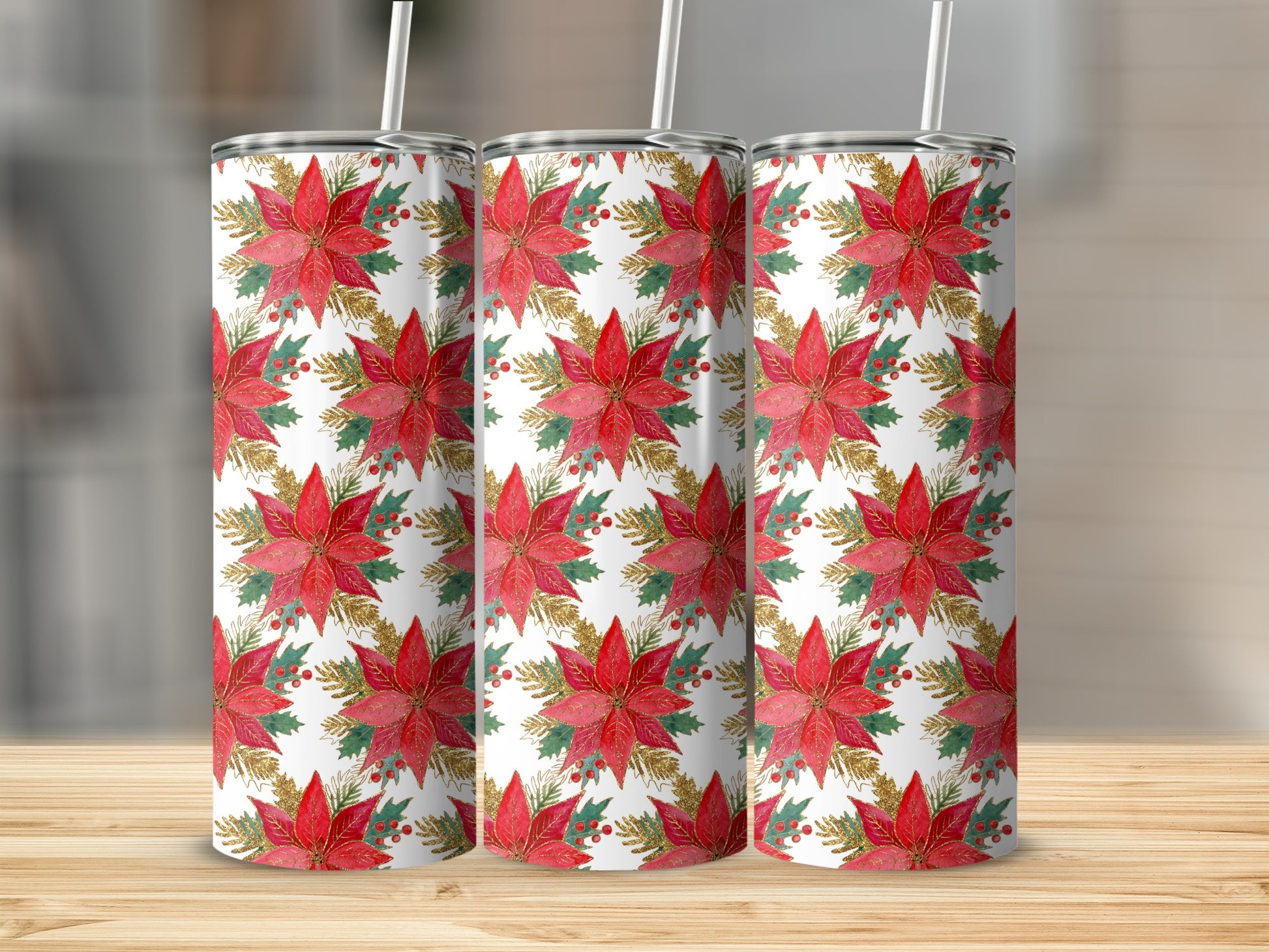 Three tumblers with red poinsettias, holly berries, and gold accents on a white background.