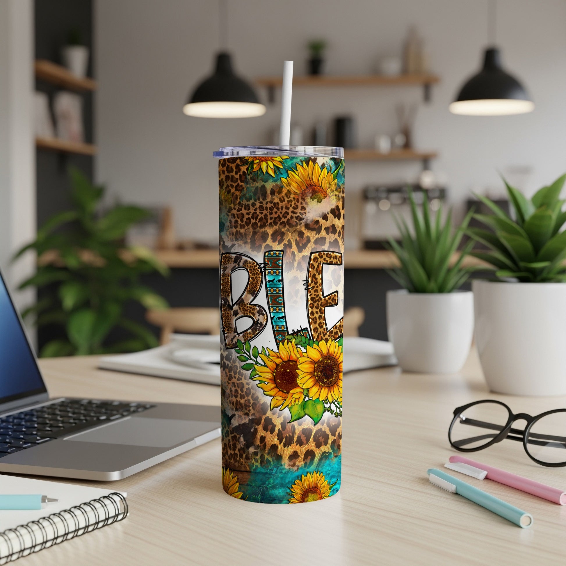 Tumbler with "Blessed" in leopard print, sunflowers, and turquoise accents.