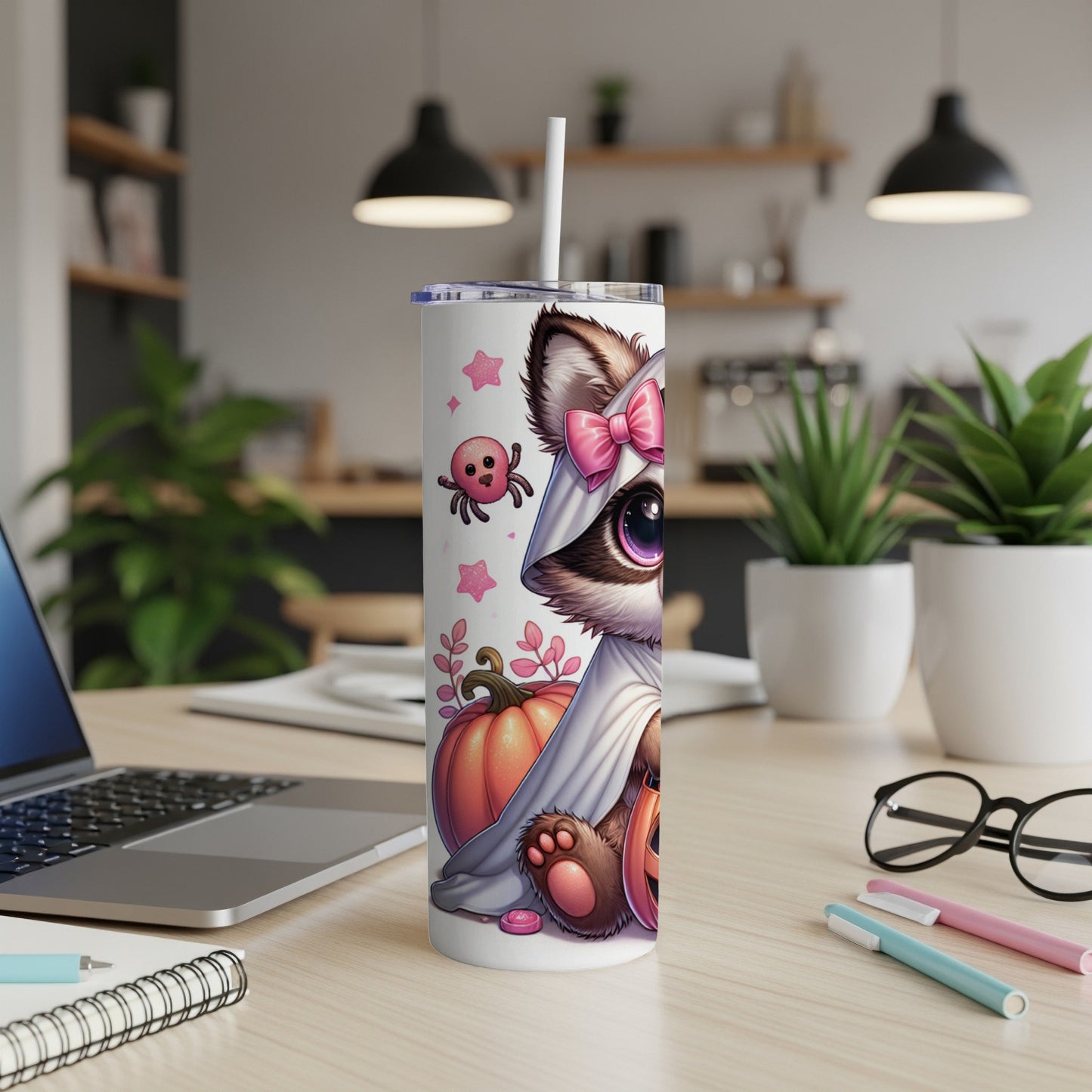 Halloween tumbler with a raccoon in a ghost costume holding a pumpkin.