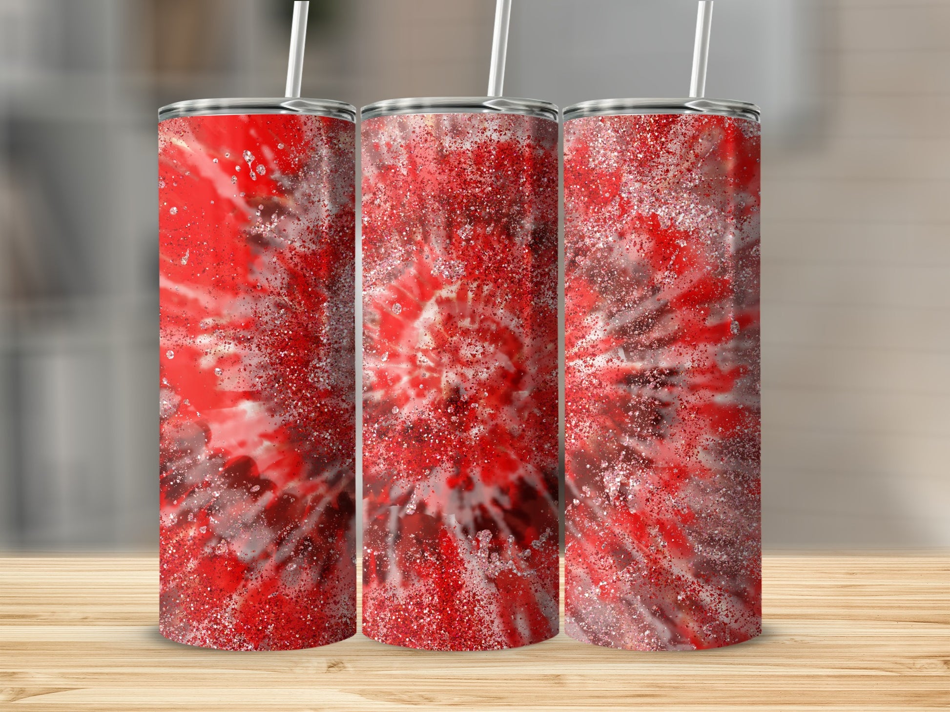 Three tumblers with a red and white tie-dye glitter design and straws.
