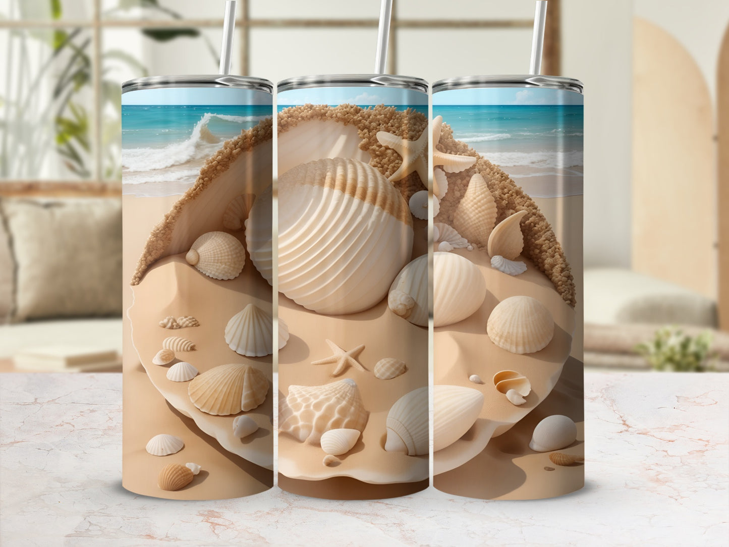Three tumblers with a beach shell and sand design.