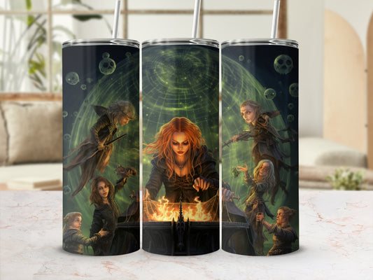 Trio of witches performing a ritual with a cauldron and glowing green orb.