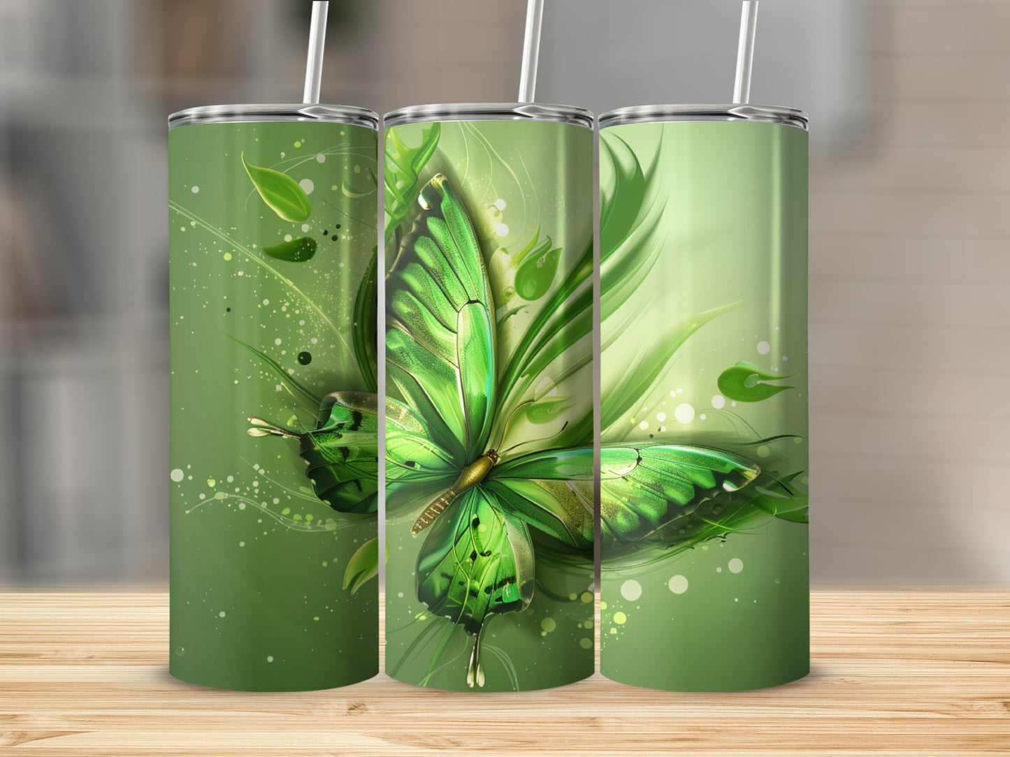 Green butterfly with swirls and leaves on three tumblers.