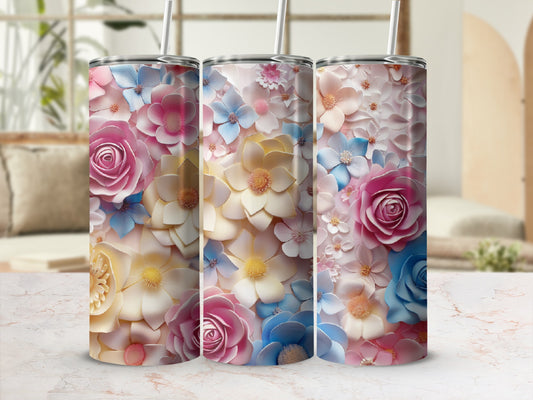 Three tall tumblers with a dense floral pattern in pink, blue, and yellow.