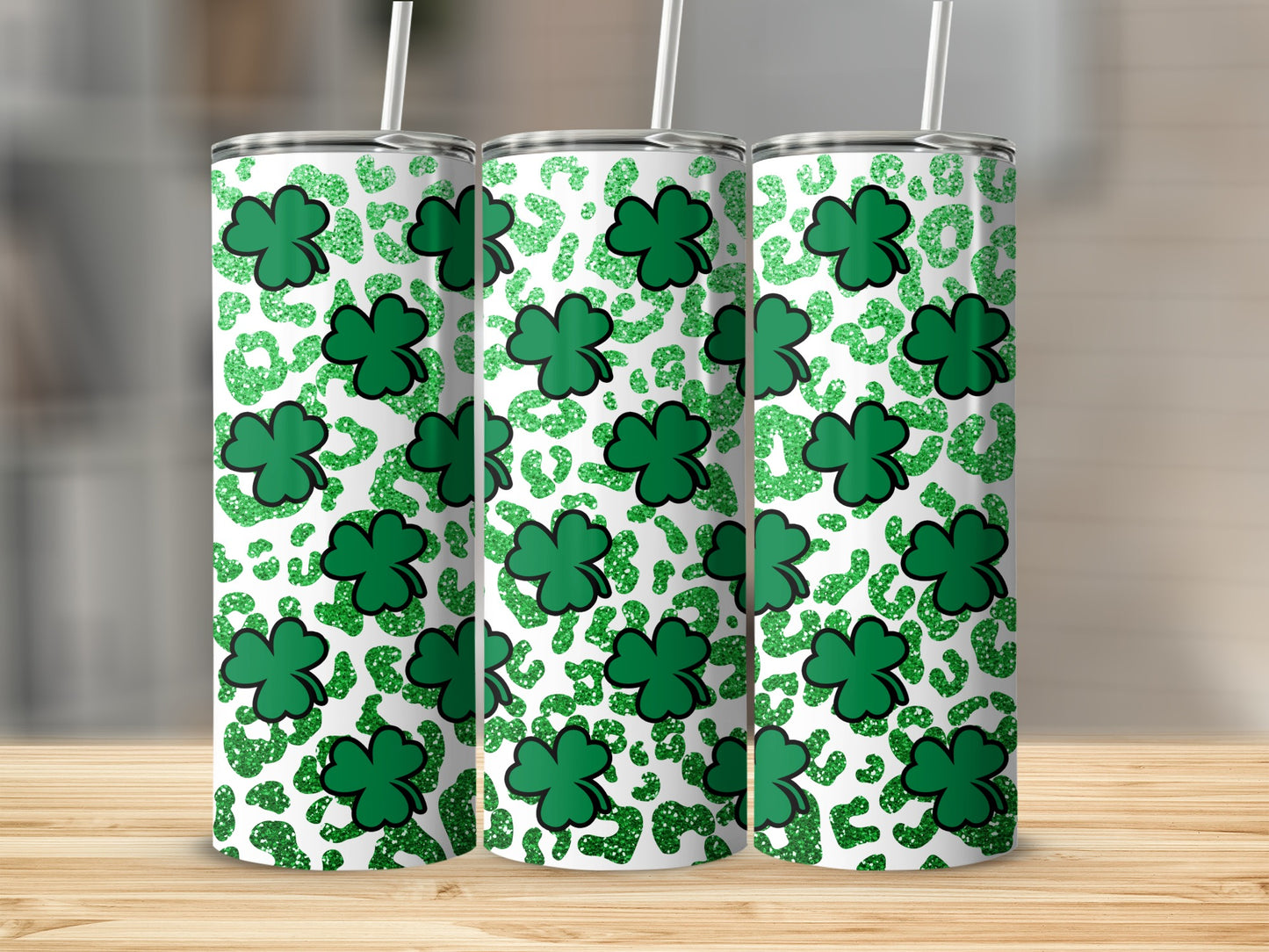 Three tumblers with St. Patrick's Day shamrock and leopard print design.