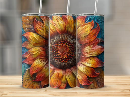 Three tumblers with a raised, textured sunflower design in warm orange and yellow tones.
