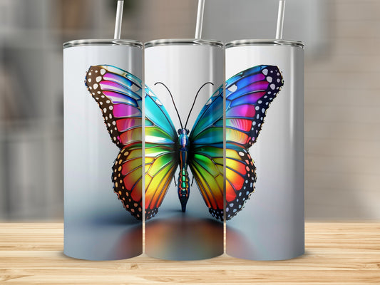 Three tumblers featuring a vibrant, rainbow-colored butterfly design.