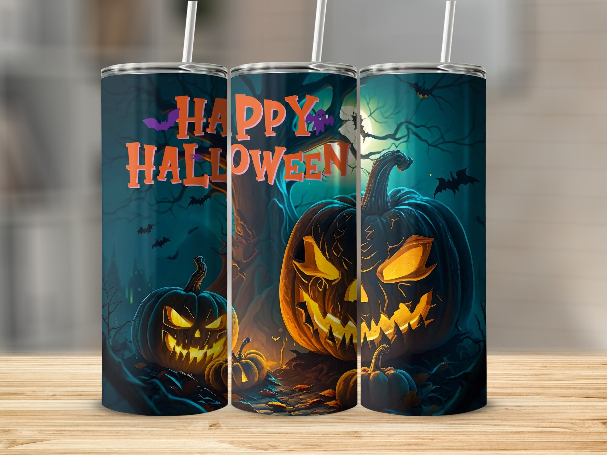 Three tumblers with Happy Halloween text and spooky pumpkins on a dark forest background.