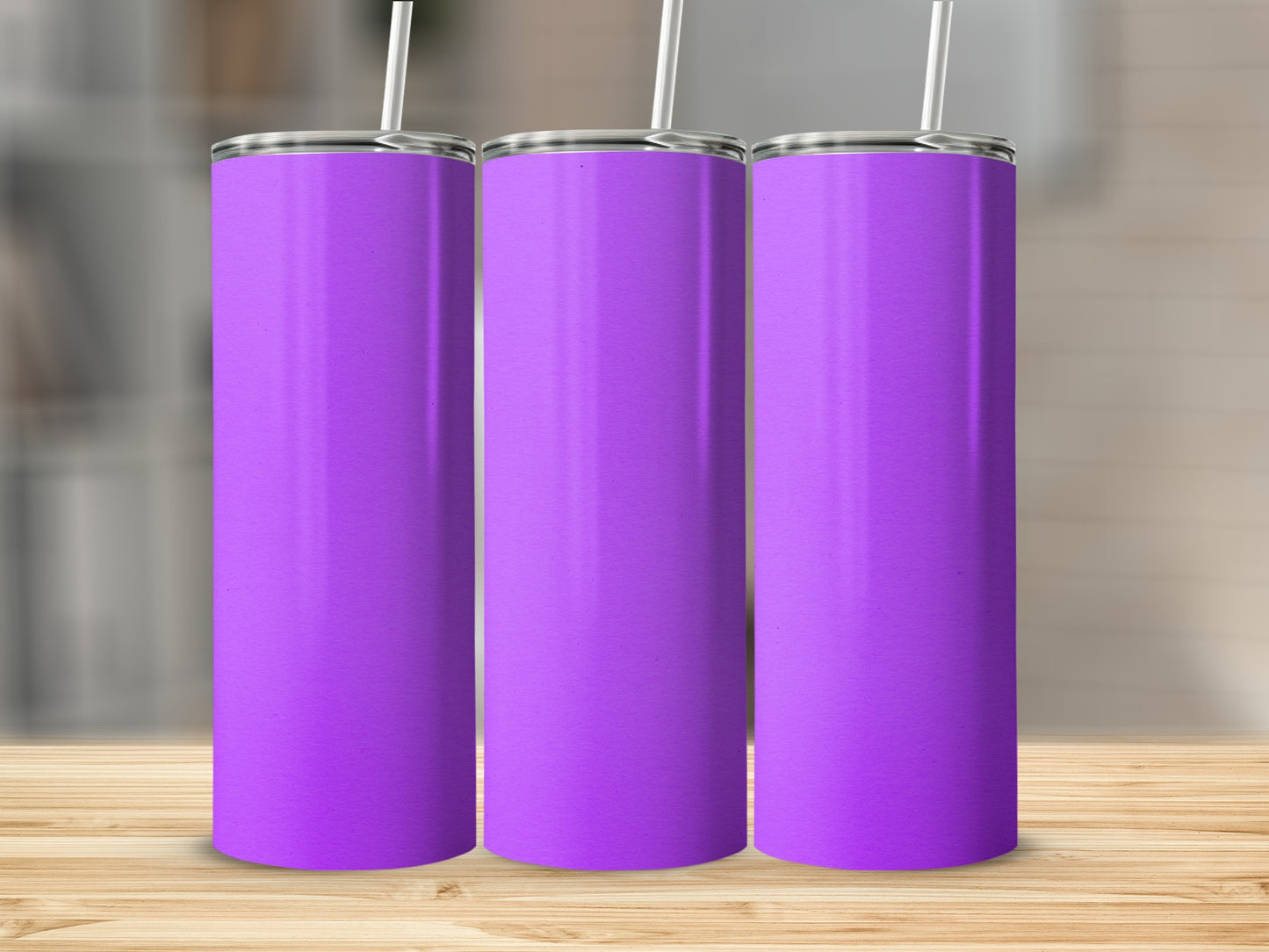 Three tall purple tumblers with white straws on a wooden surface.