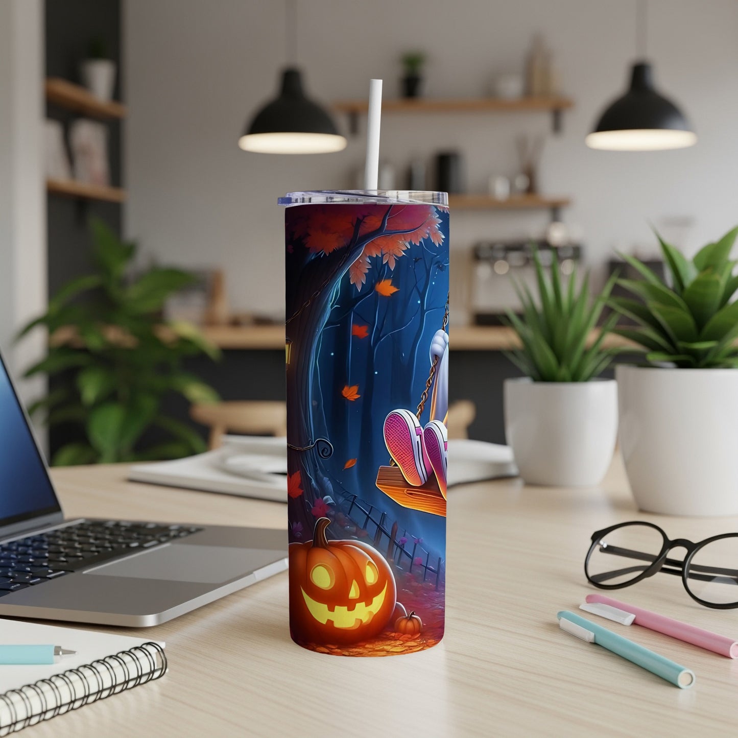 Tumbler with Halloween forest scene, jack-o'-lantern, and a figure on a swing.