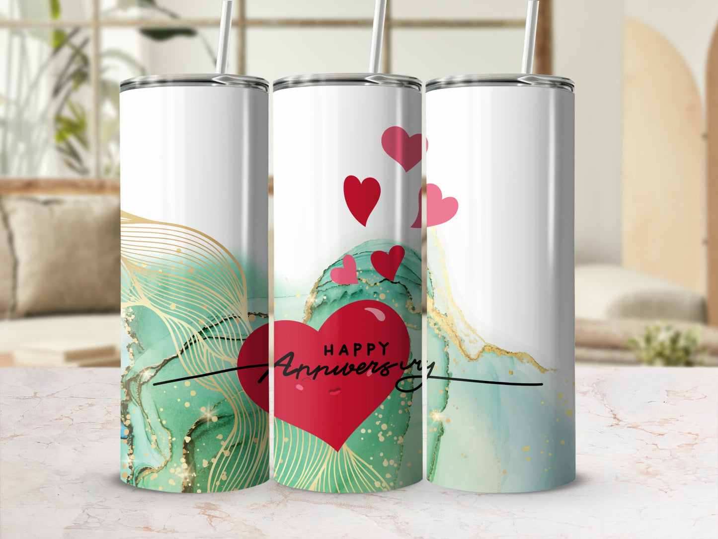 Three tumblers with a red heart and "Happy Anniversary" text on marble background.