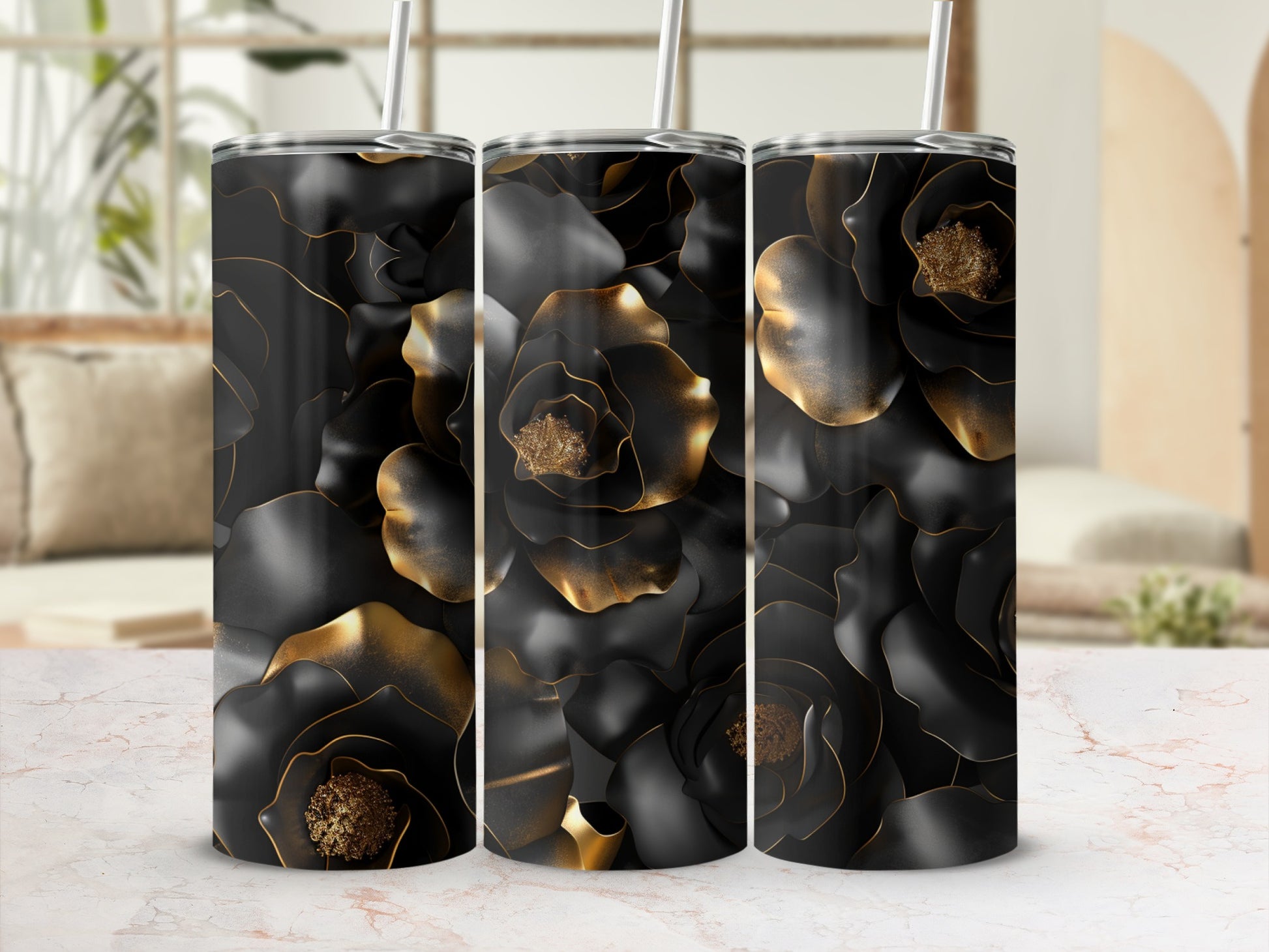 Three black tumblers with gold floral pattern, white straws.
