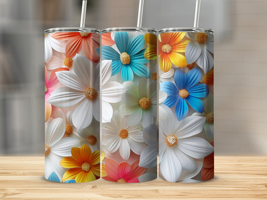 Three tumblers with floral patterns in white, orange, blue, and pink.