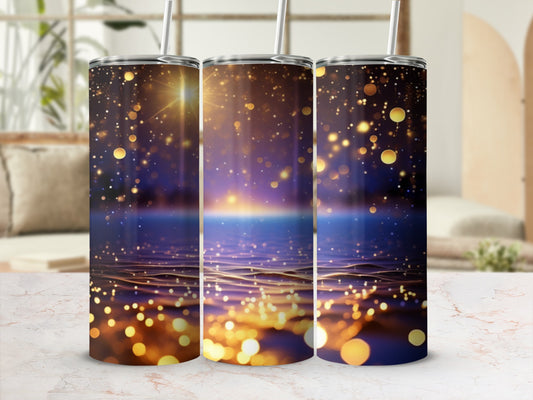 Three tumblers with sparkling gold and blue bokeh background.
