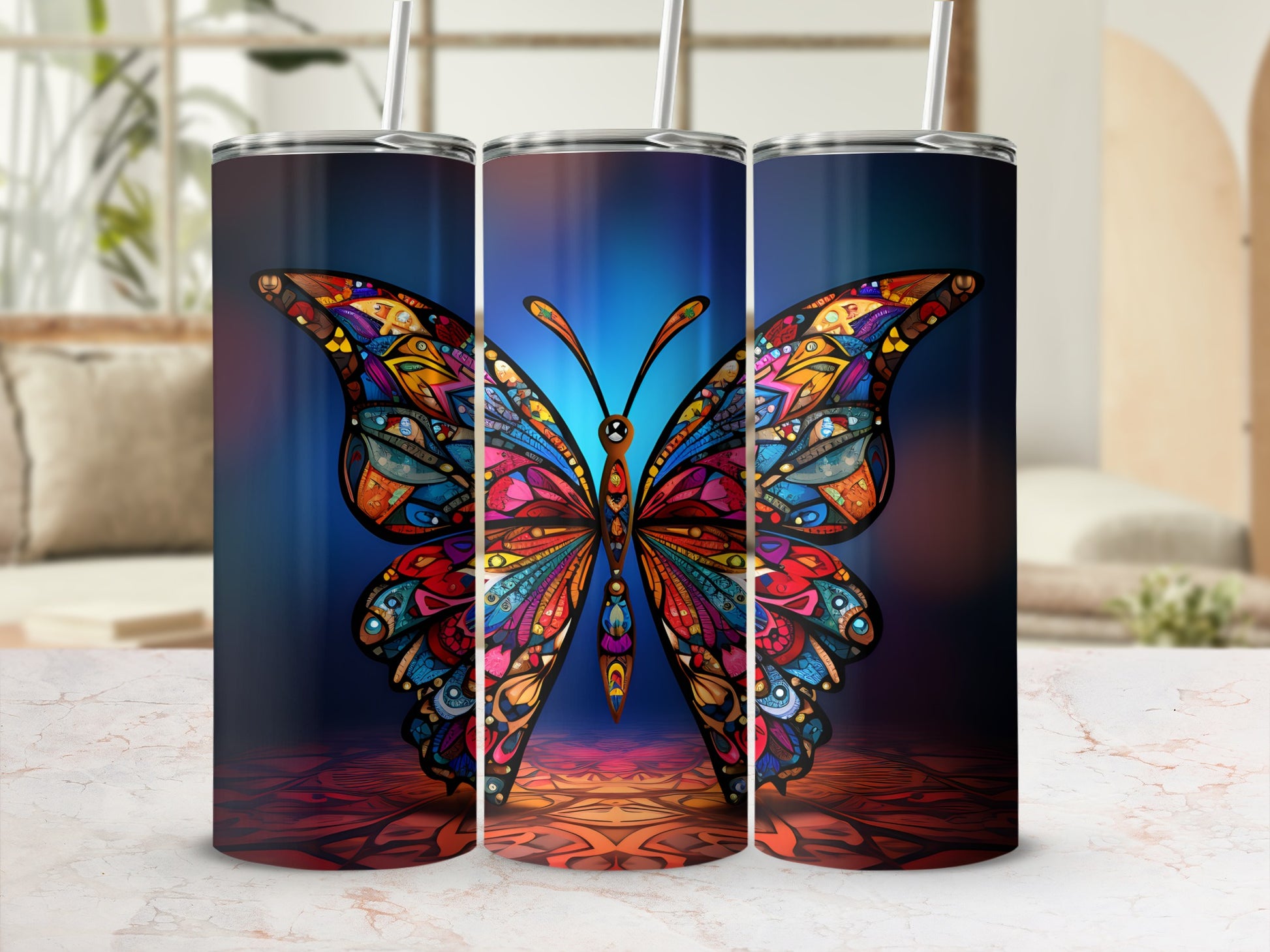 Colorful butterfly design on a tall, insulated tumbler with straw.