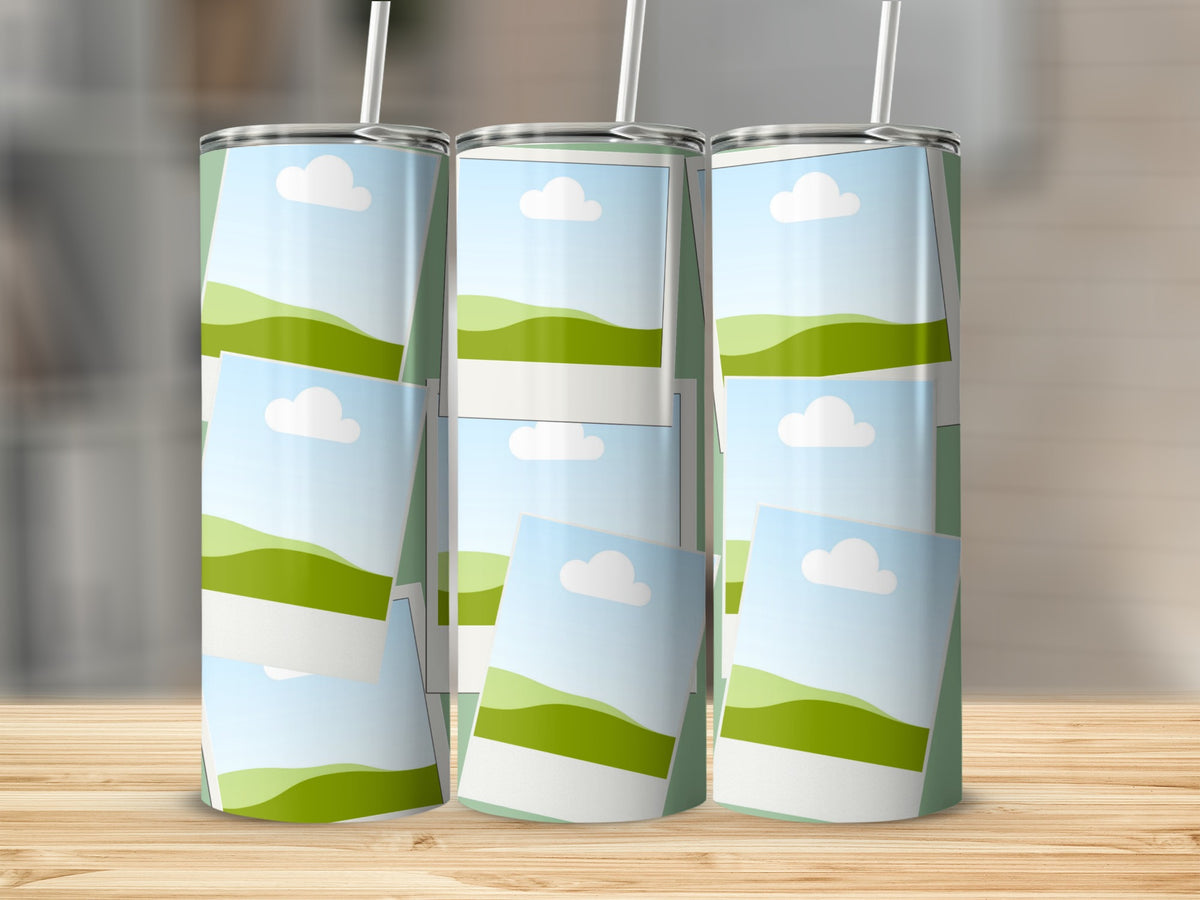 Three tumblers with a green and white landscape design and white straws.