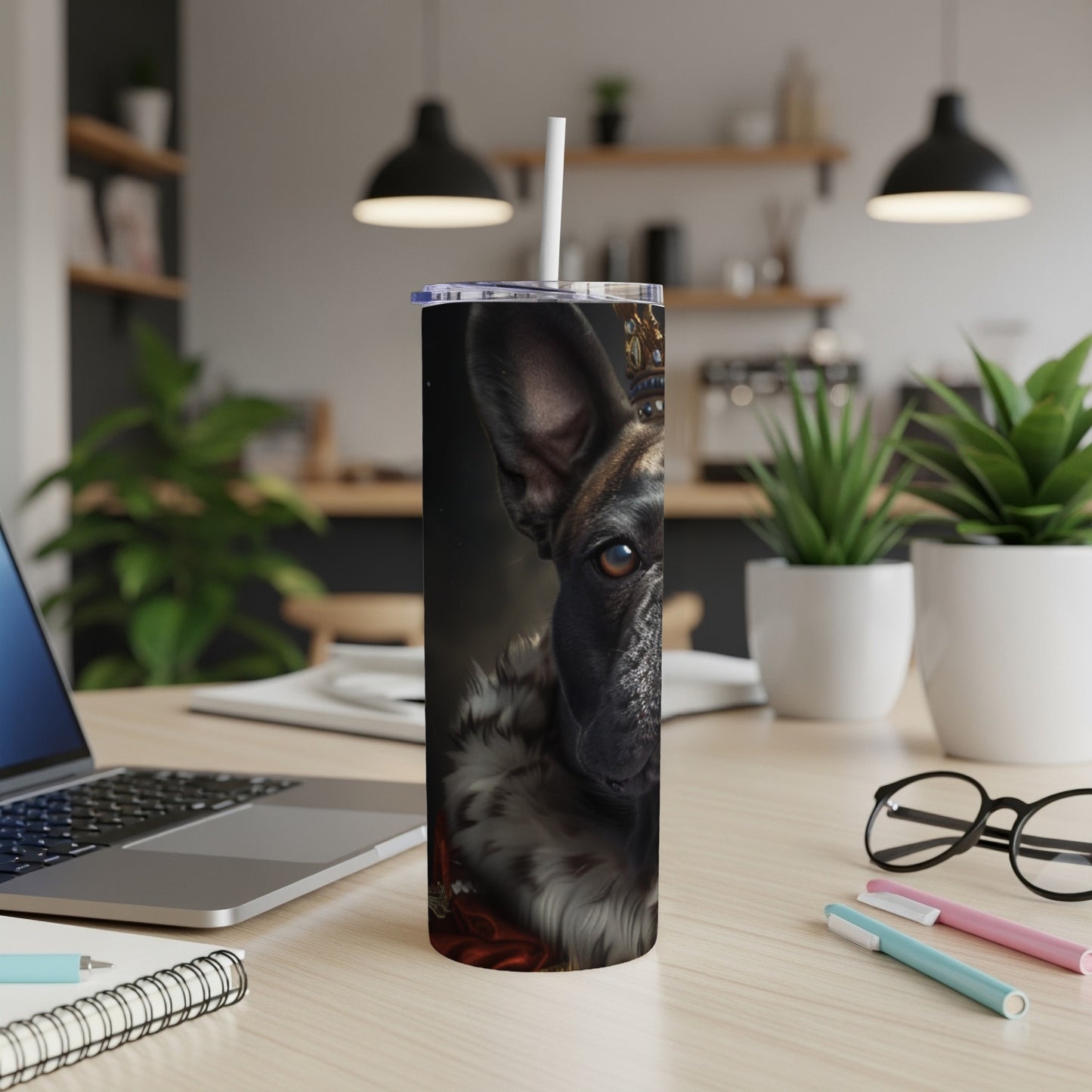 French bulldog wearing a crown and fur collar on a tumbler.