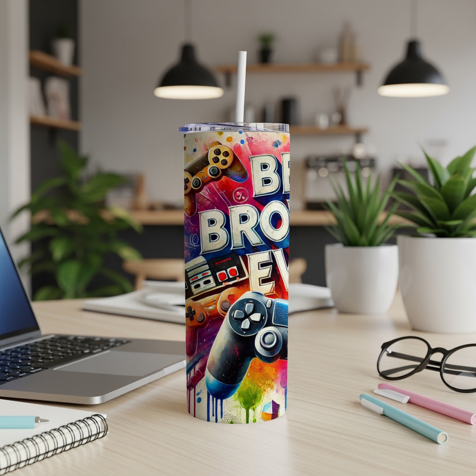 Colorful gaming-themed tumbler with controllers and abstract paint splatters.