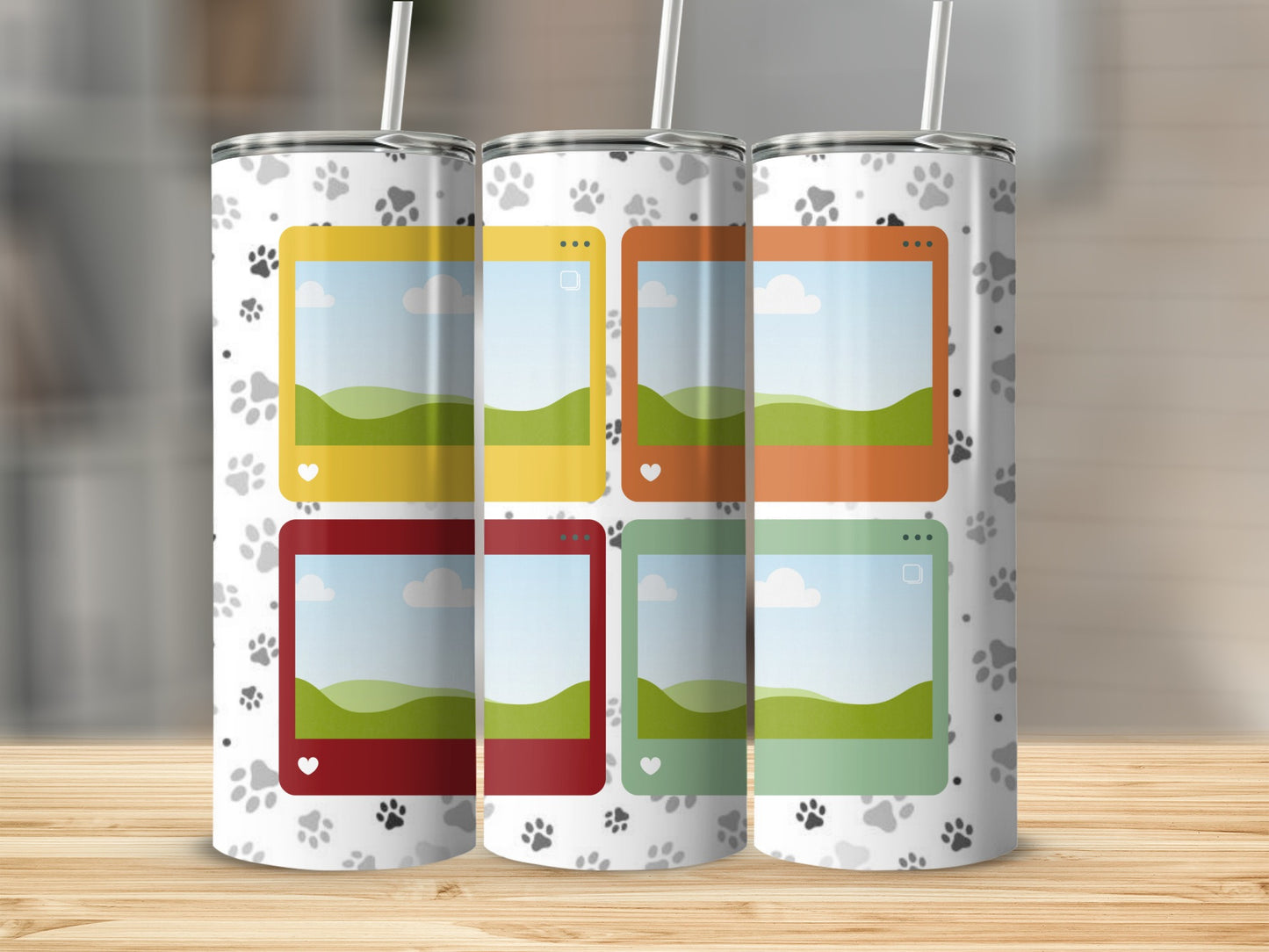 Tumbler with white paw print pattern and four colored frames with landscape scenes.