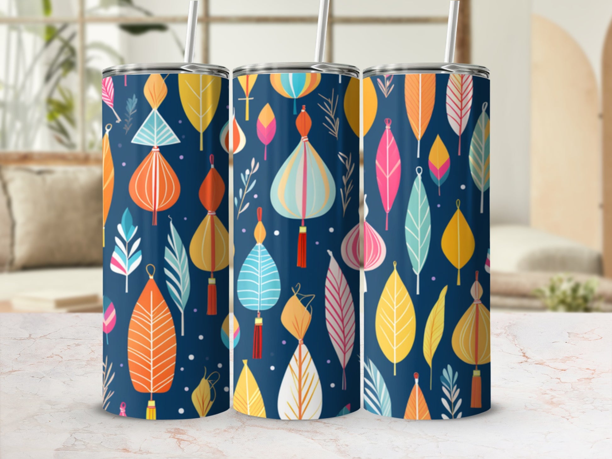 Three blue tumblers with colorful falling leaf and lantern pattern.
