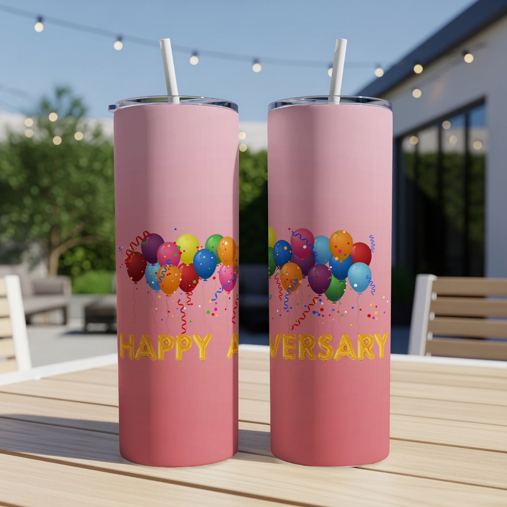 Pink tumbler with balloons and "Happy Anniversary" text.