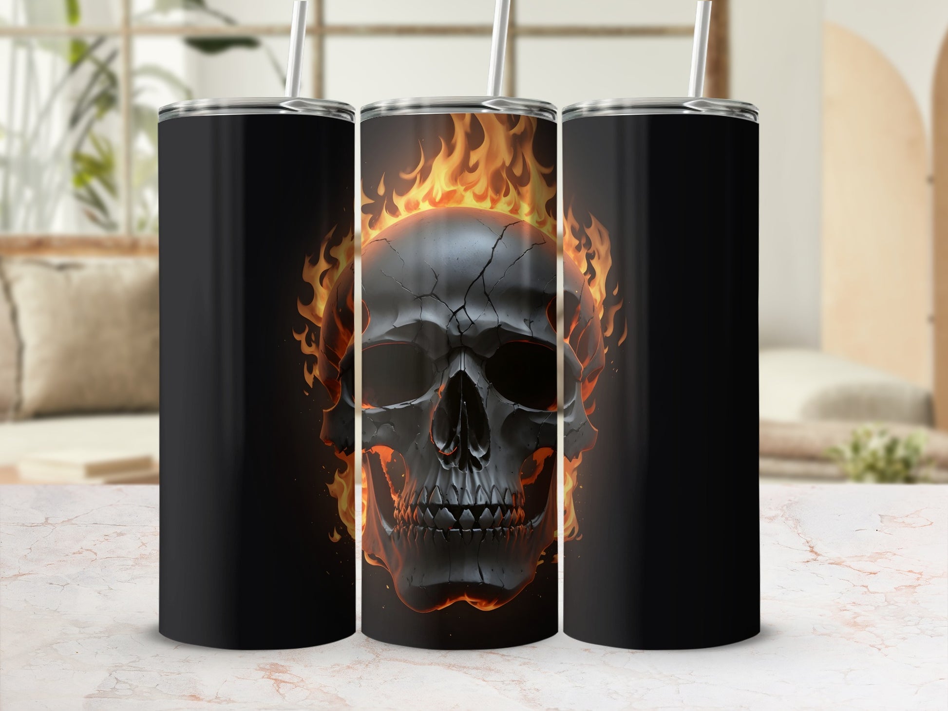 Black tumbler with a flaming skull design on a white marbled surface.