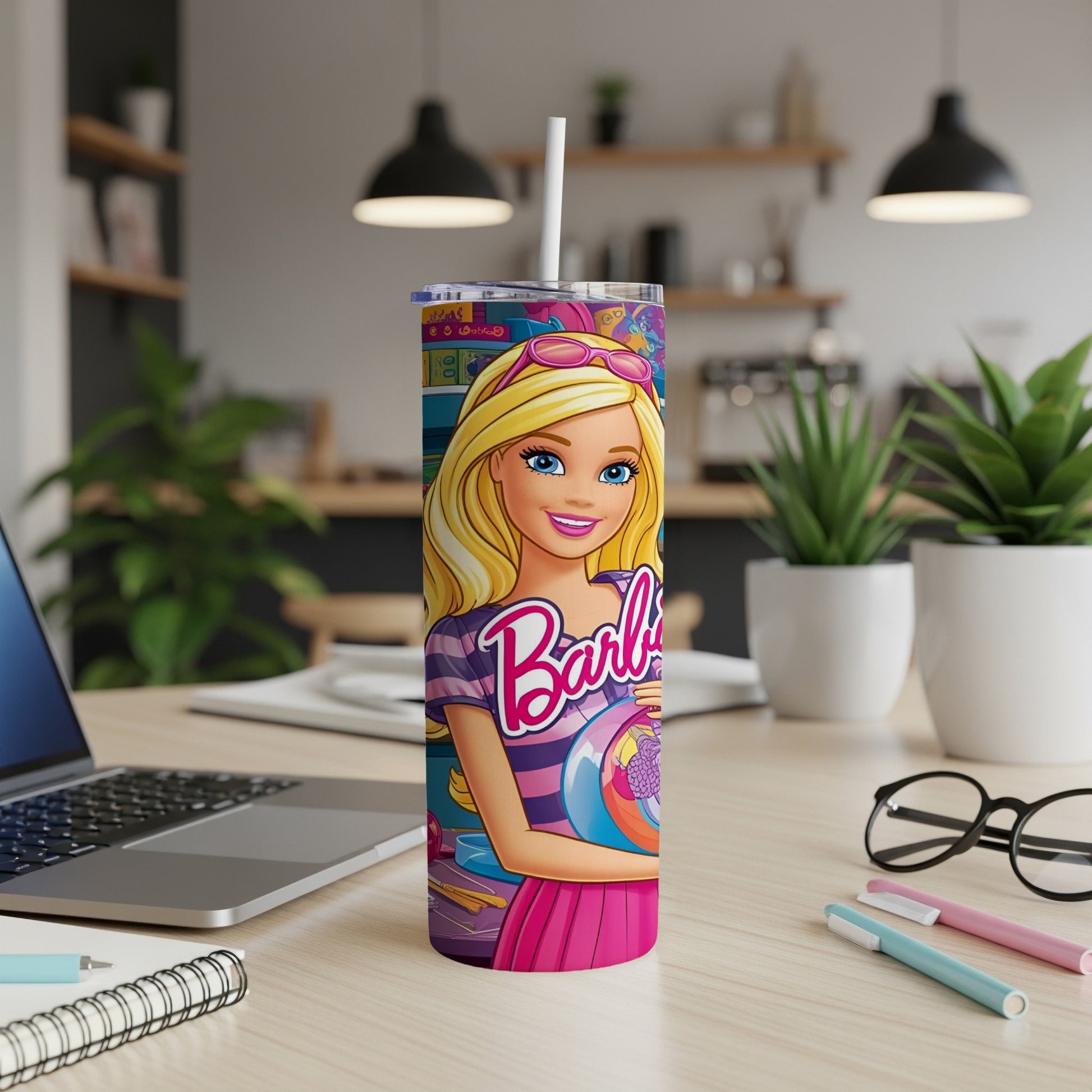 Barbie tumbler with straw, featuring Barbie in a pink outfit and sunglasses.