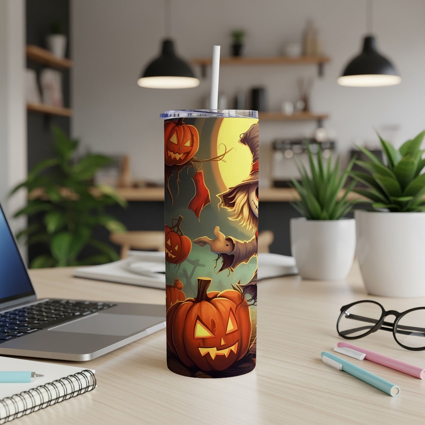 Halloween tumbler with jack-o'-lanterns, a scarecrow, and bats against a moonlit background.