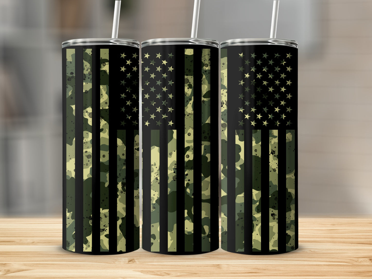 Three tumblers with camouflage American flag design and straws.