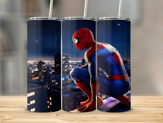 Spiderman crouches on a rooftop overlooking a city at night.