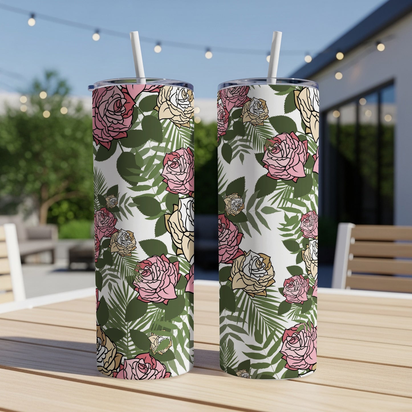 Two tumblers with a pink, white, and yellow rose and green leaf pattern.