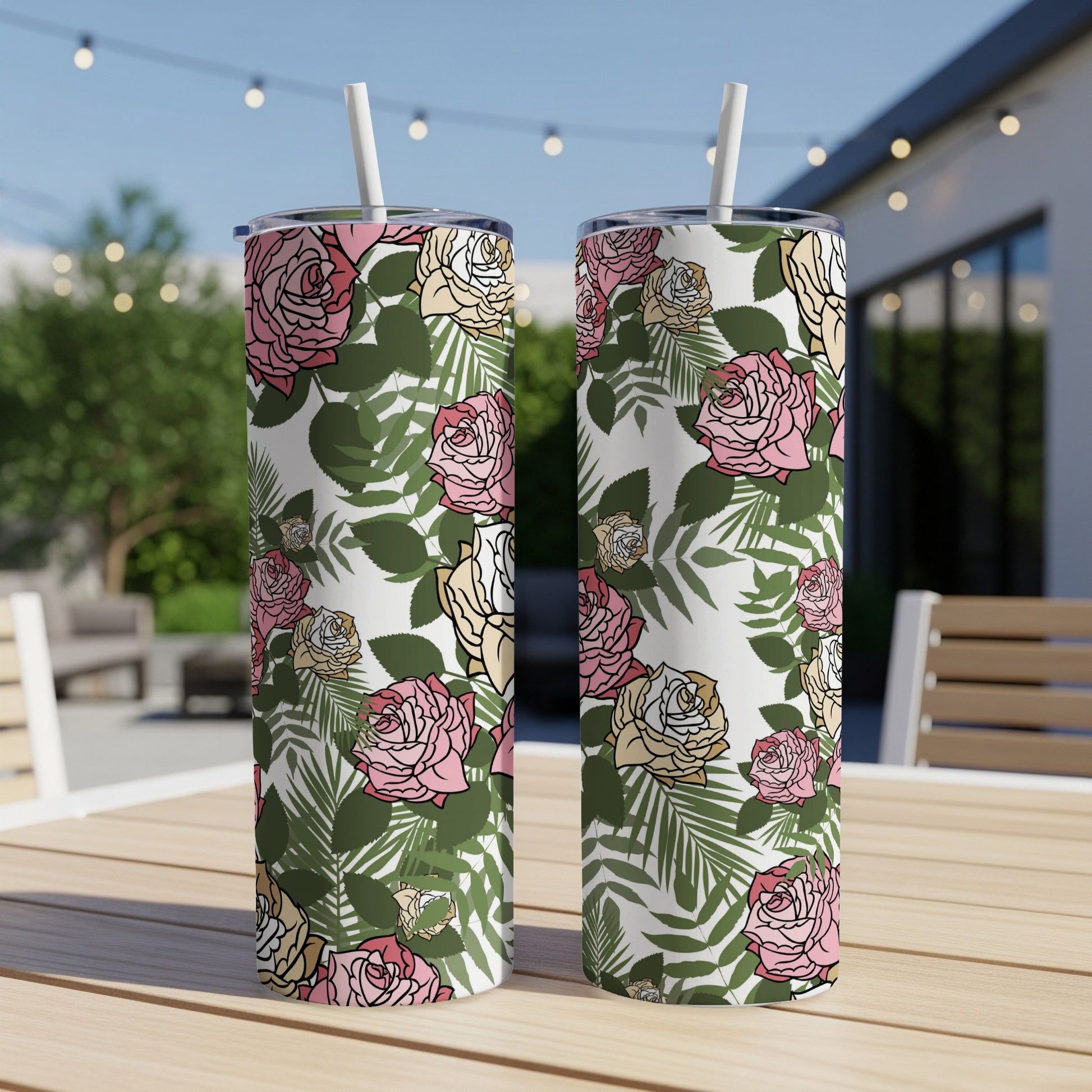 Two tumblers with a pink, white, and yellow rose and green leaf pattern.