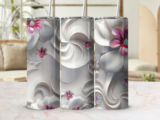 Three insulated tumblers with floral swirl designs and pink accents.