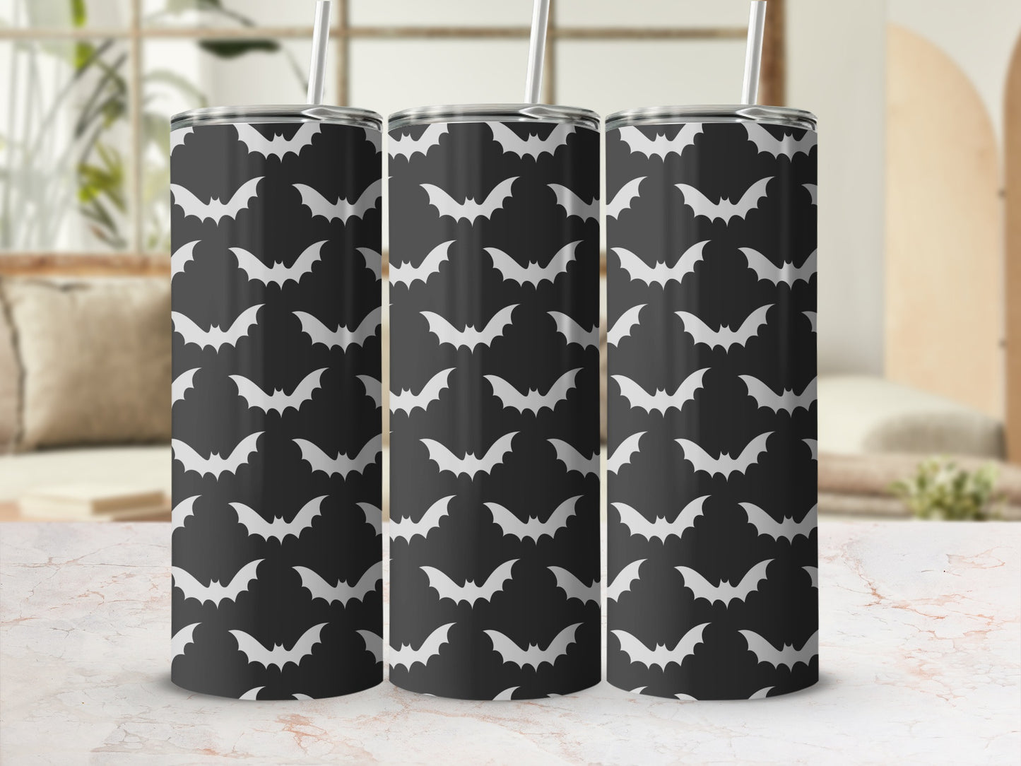 Three tumblers with a repeating pattern of white bats on a black background.