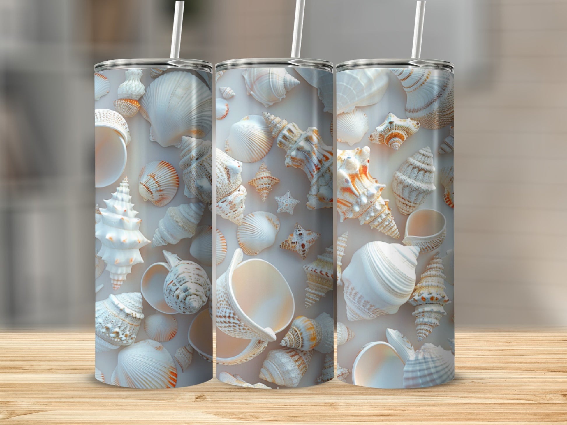 Three white tumblers with various seashells and starfish designs.