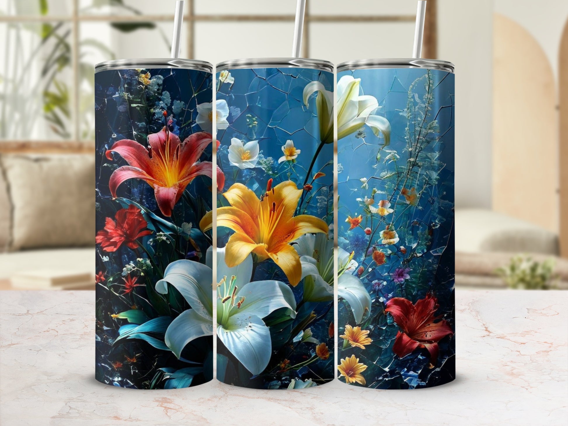 Tall tumbler with vibrant lilies and red flowers against a blue, textured background.