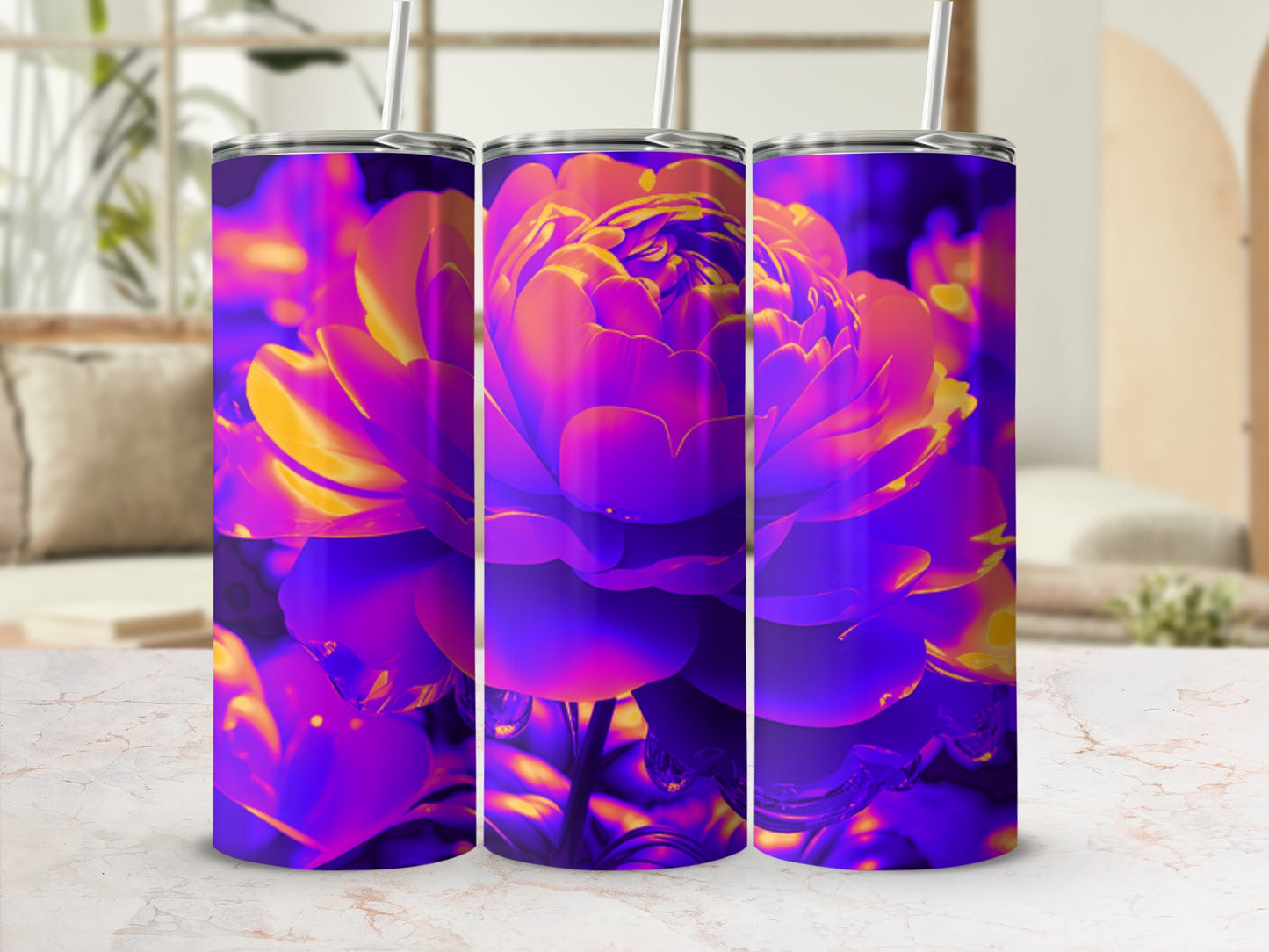 Three purple and yellow floral tumblers with straw, displayed on a marble surface.