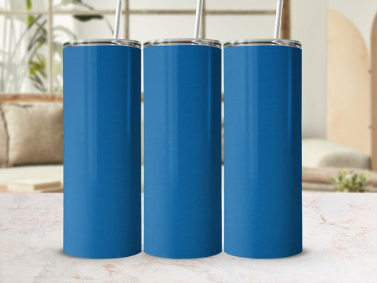 Three blue tumblers with straws on a marble surface.