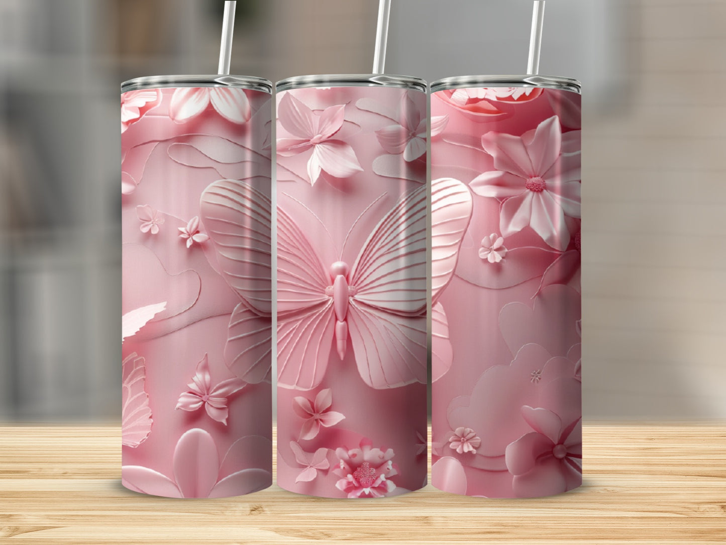 Pink tumbler with butterfly and floral embossed design.