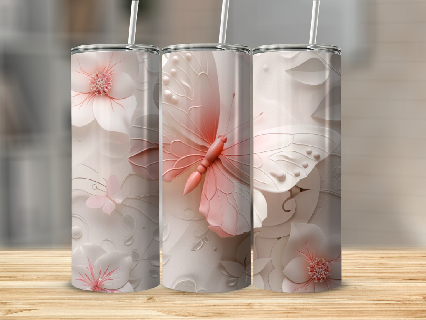 Three white tumblers with delicate floral and butterfly designs.