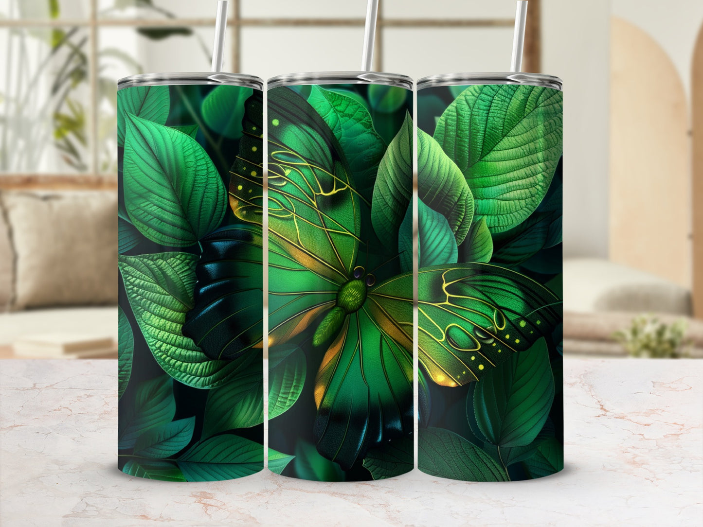 Green butterfly and leaves design on three tumblers.