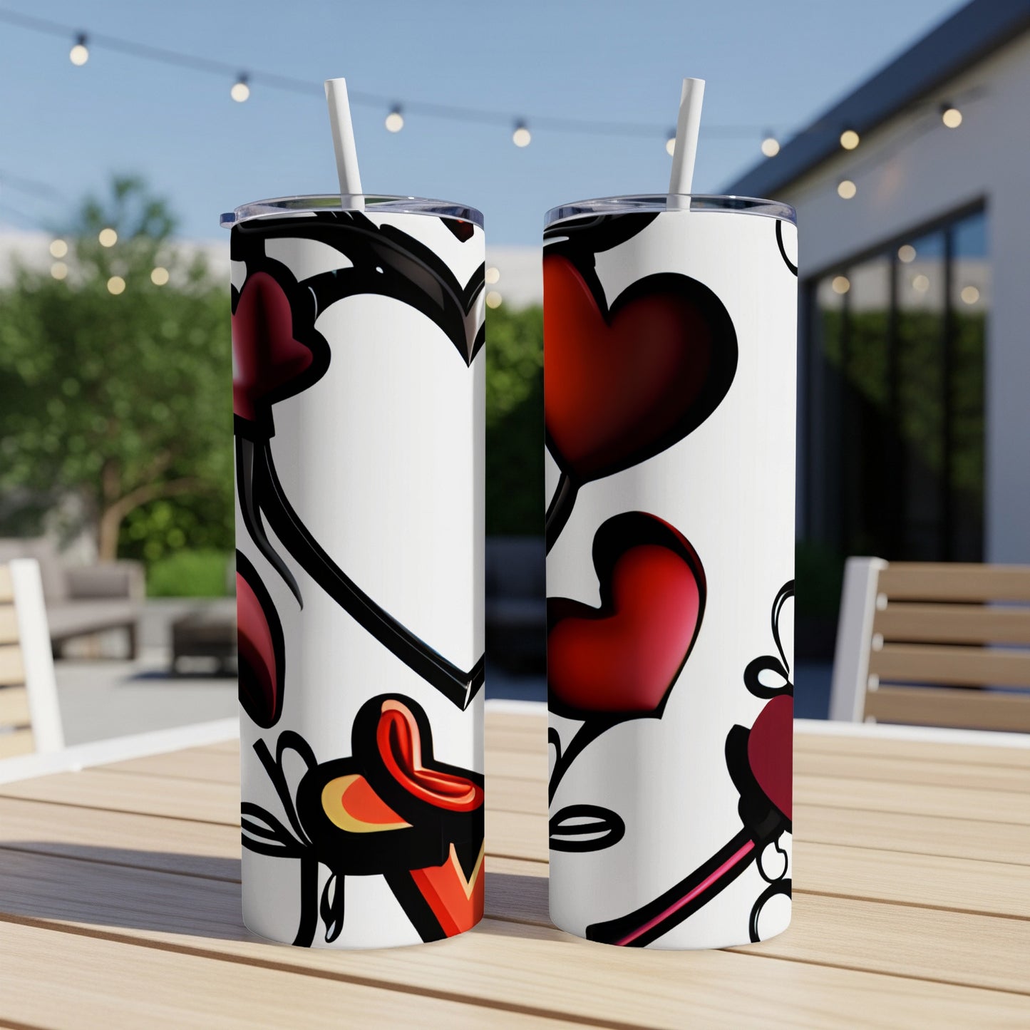 Two white tumblers with a red heart and black heart outline pattern.