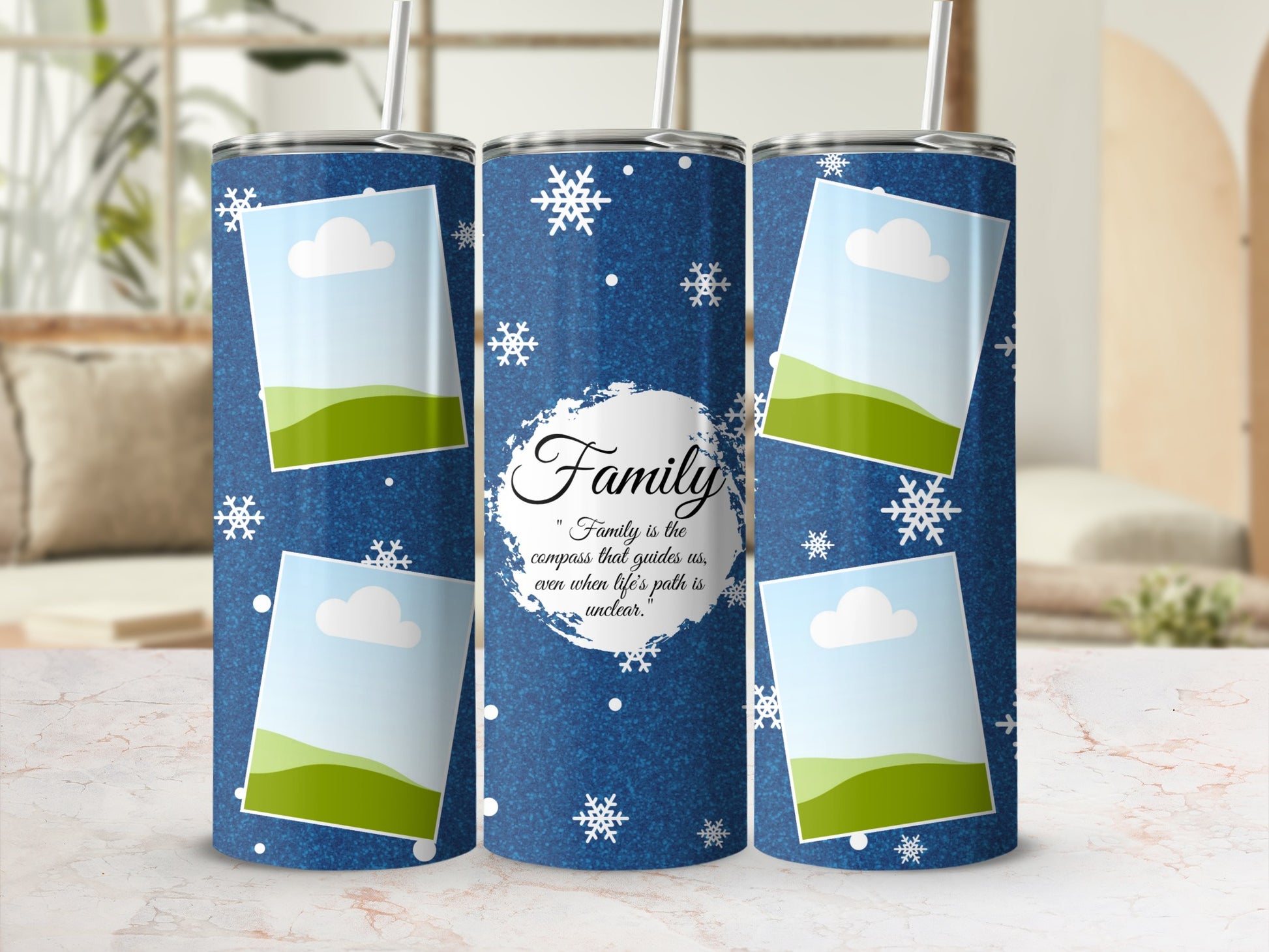 Blue tumbler with snowflakes, framed photos, and text "Family is the compass that guides us".