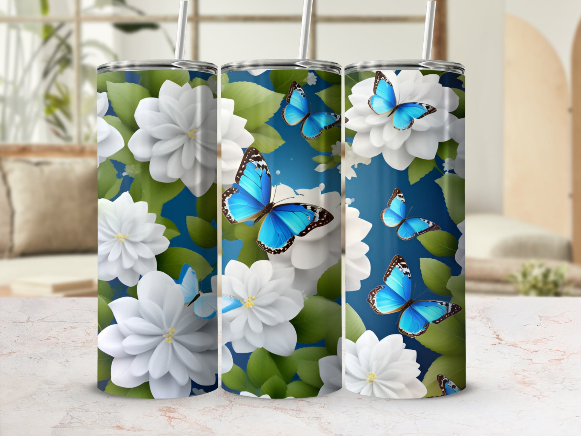 White flowers and blue butterflies adorn a cylindrical tumbler.