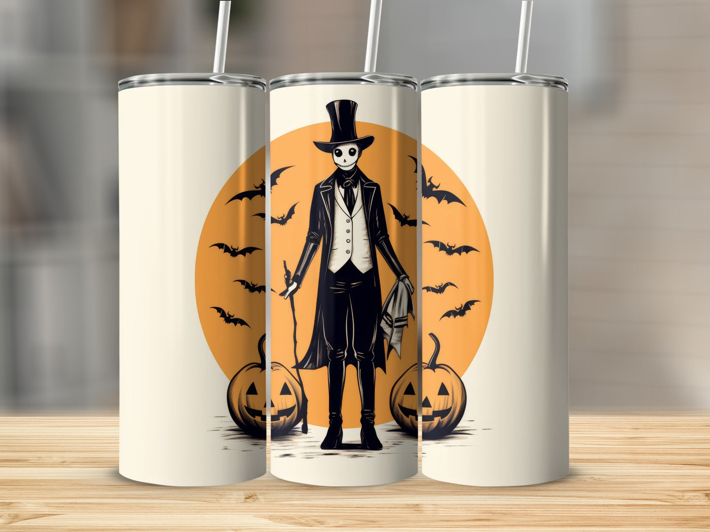 Tall tumbler with a skeleton in a top hat, bats, and pumpkins design.