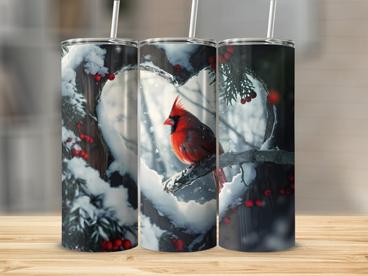 Three tumblers featuring a cardinal perched on a snowy branch within a heart-shaped opening.