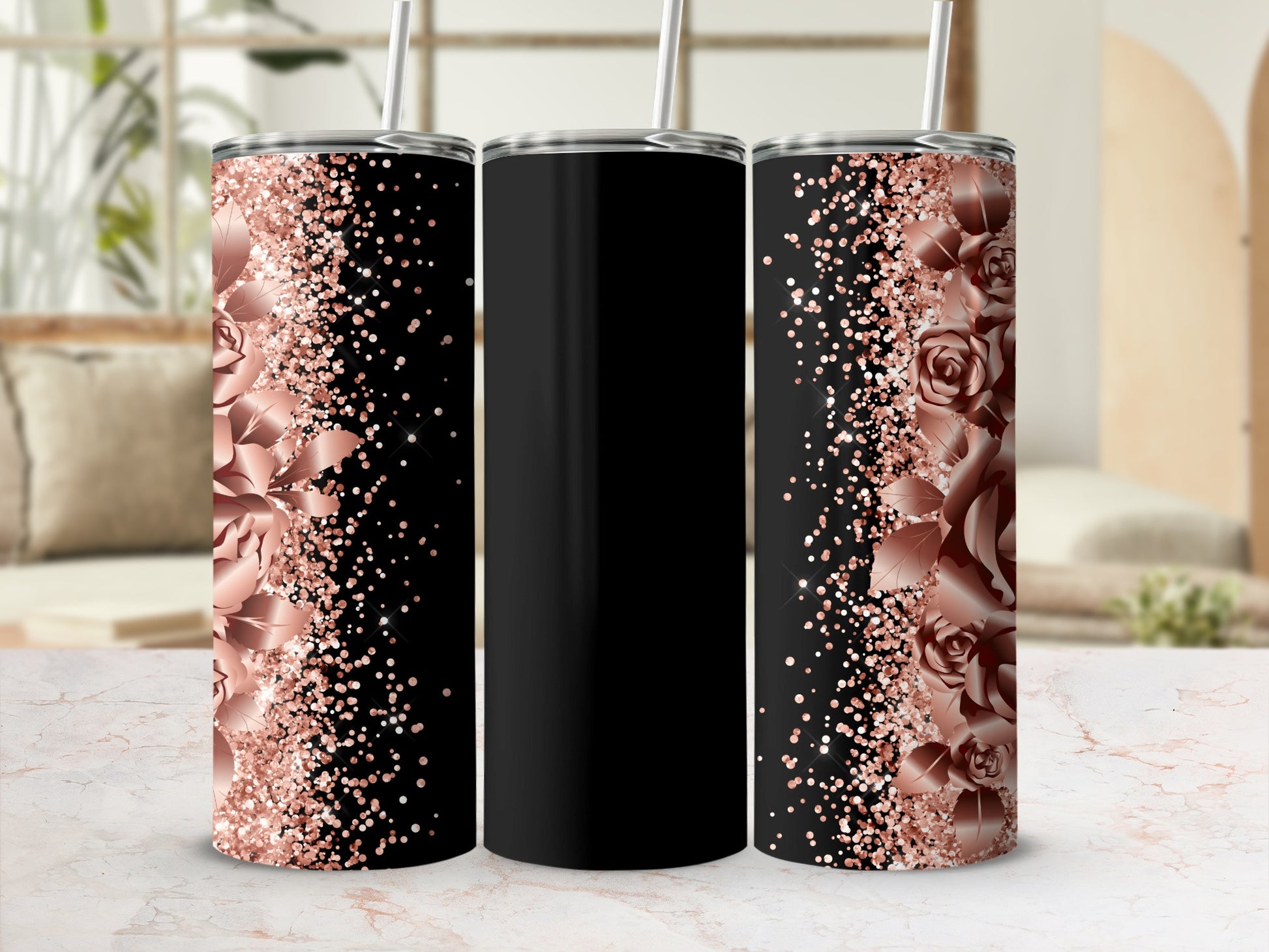 Black tumbler with rose gold floral glitter accents and straw.