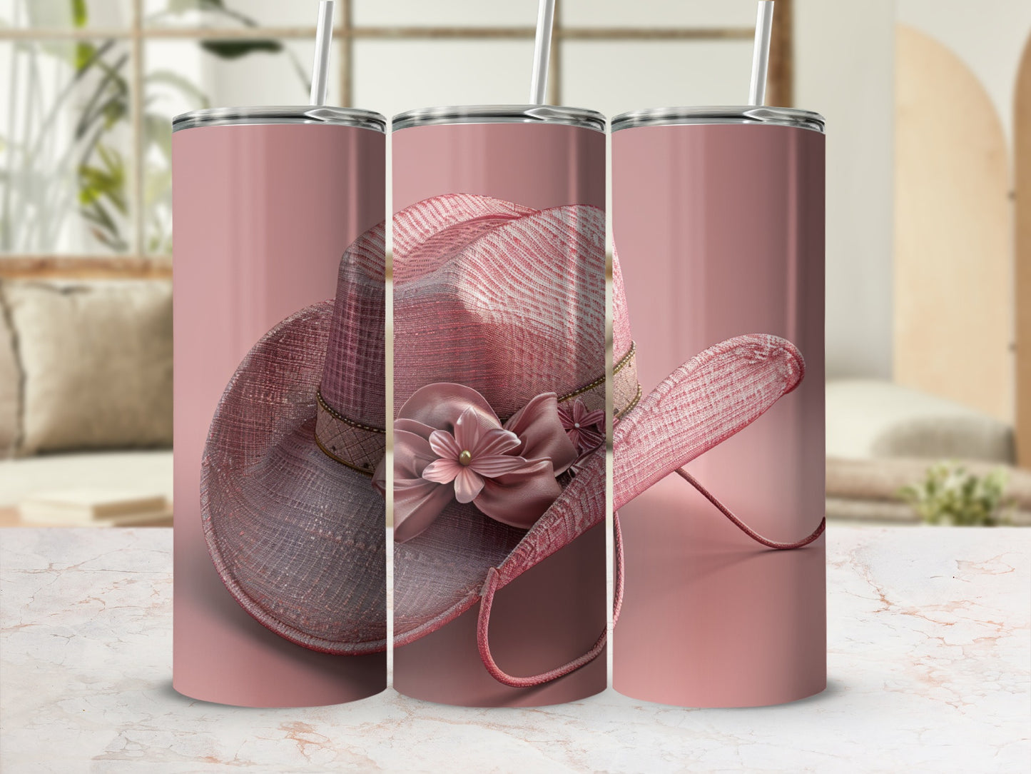Pink cowboy hat with floral embellishment on a tumbler.