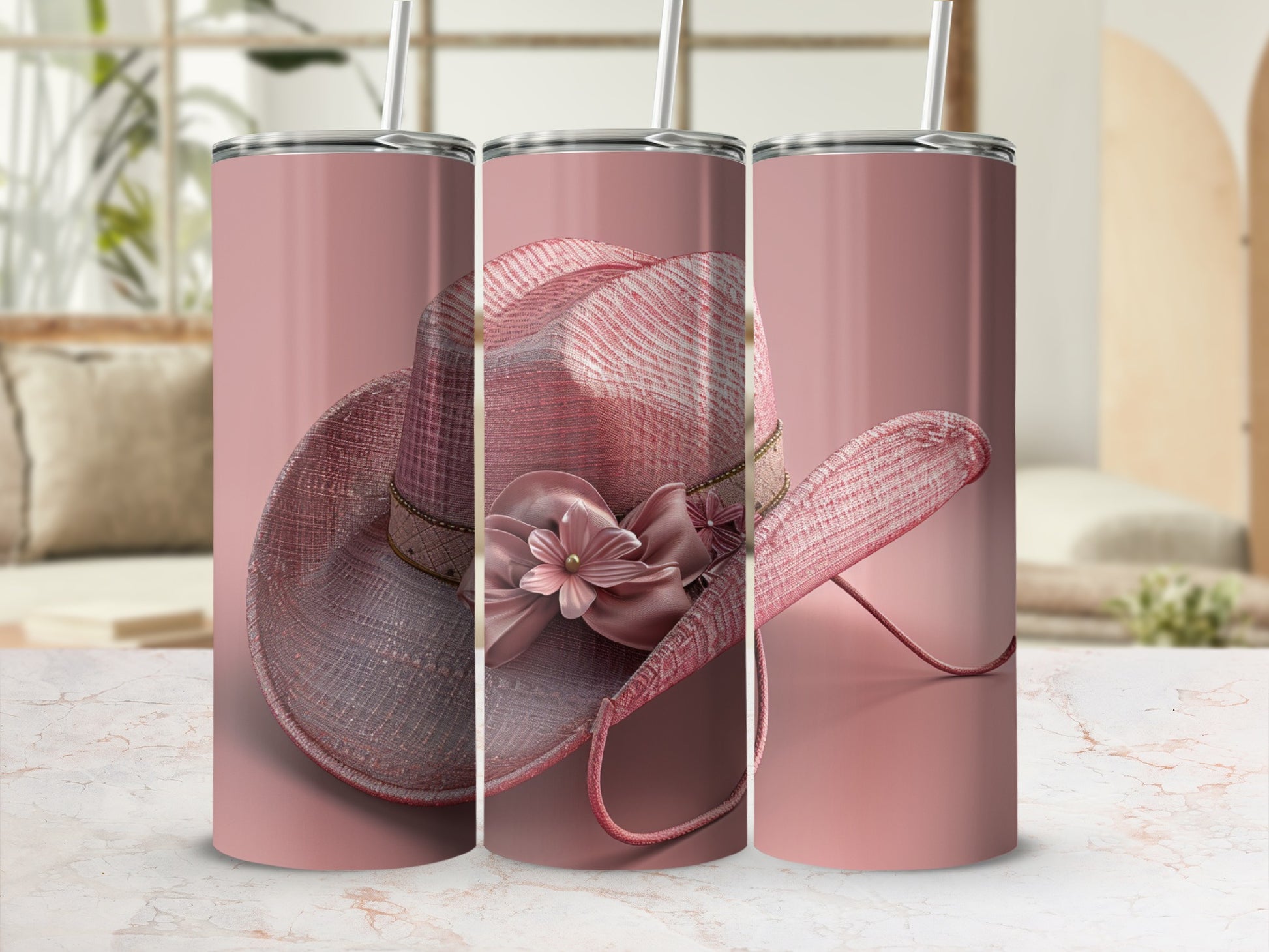Pink cowboy hat with floral embellishment on a tumbler.